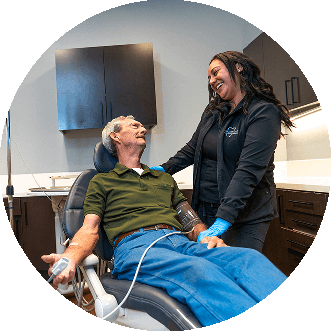 patient being helped by a staff member within the dental center