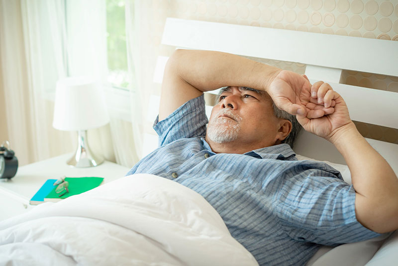 older male having difficulties sleeping