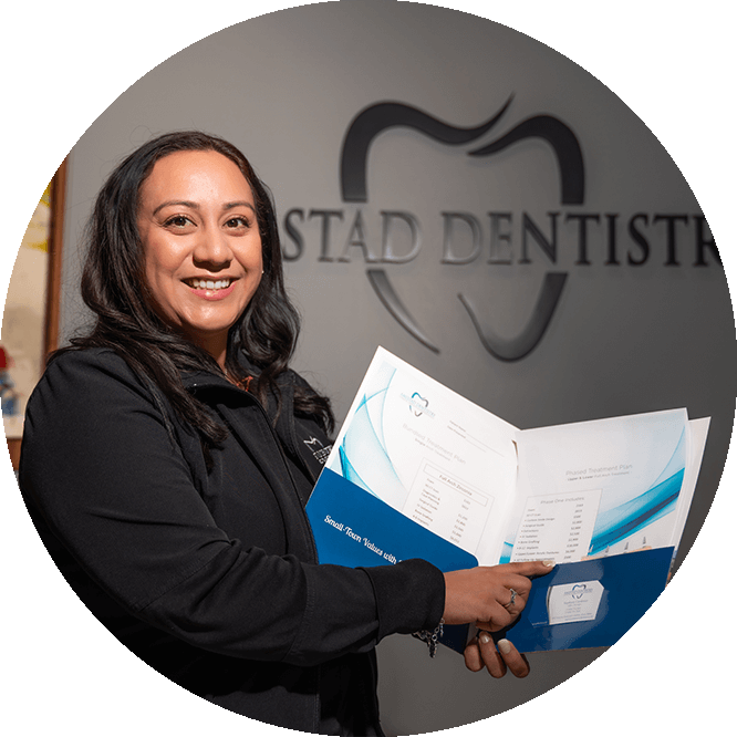 close up of patient holding finance programs for the dental center